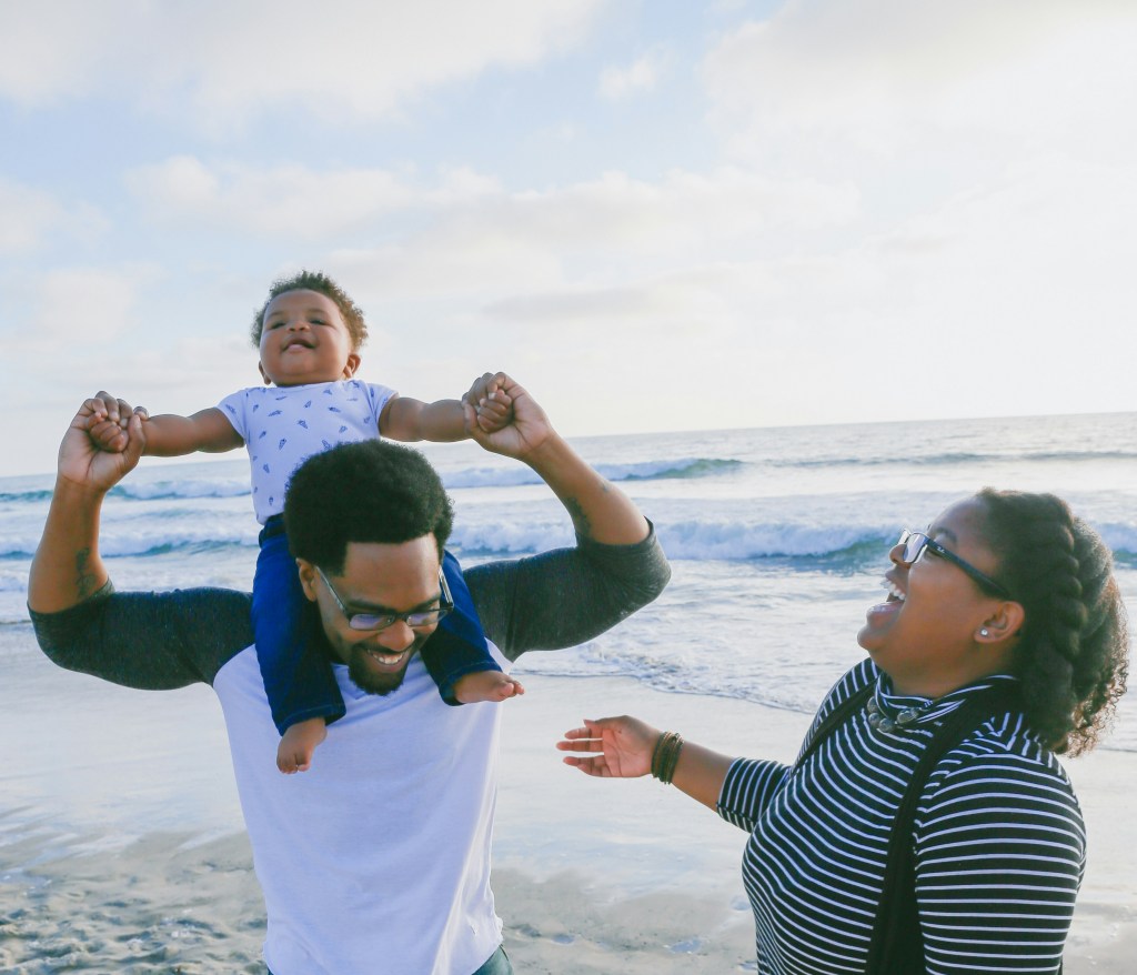 Family playing together on the beach